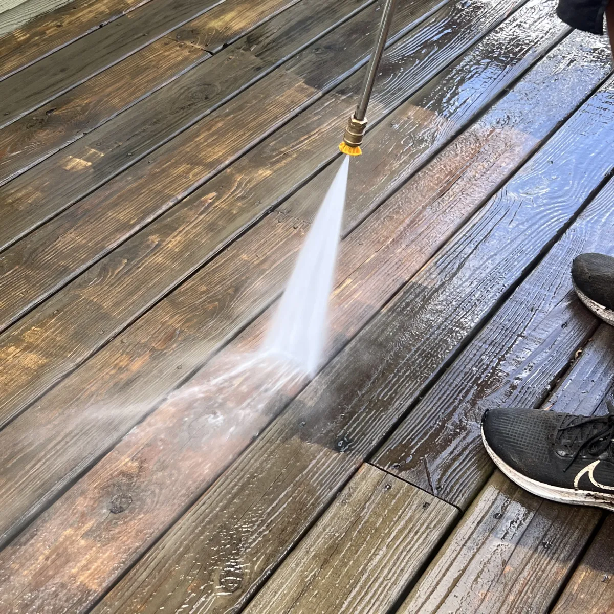 Pressure washing a wooden deck